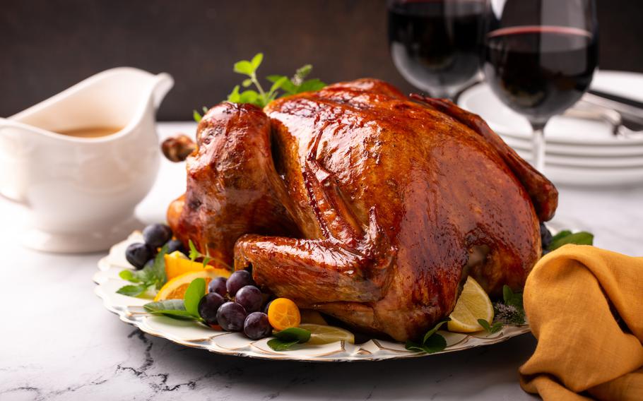 Whole roasted turkey for a celebration Thanksgiving or Christmas dinner with gravy