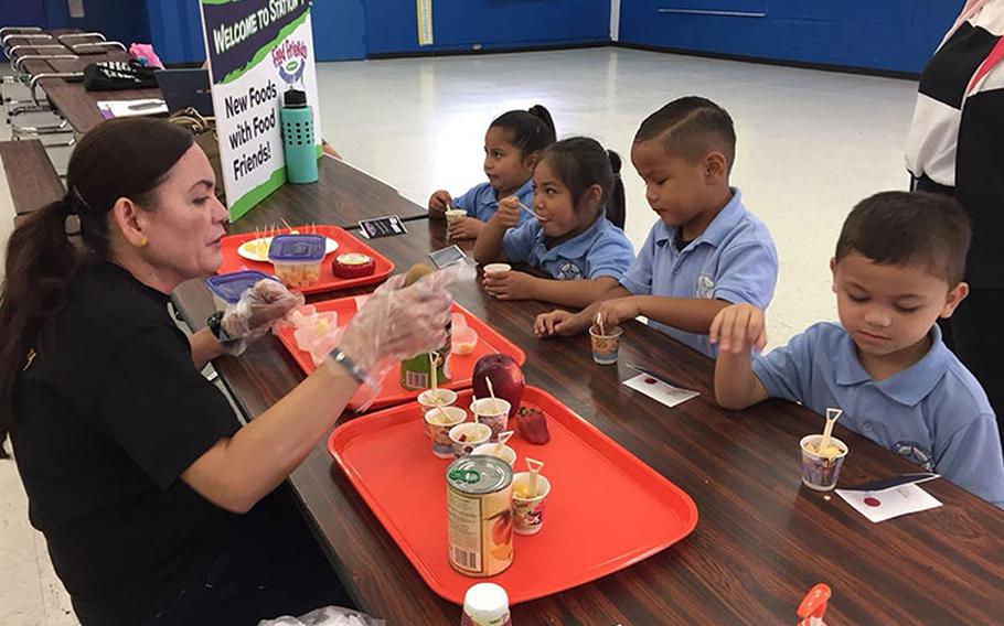 “Food Friends,” one of the activities of the Children’s Healthy Living Program, brings its message to an elementary school in May 2019 to promote healthy eating. Photos courtesy of the University of Guam