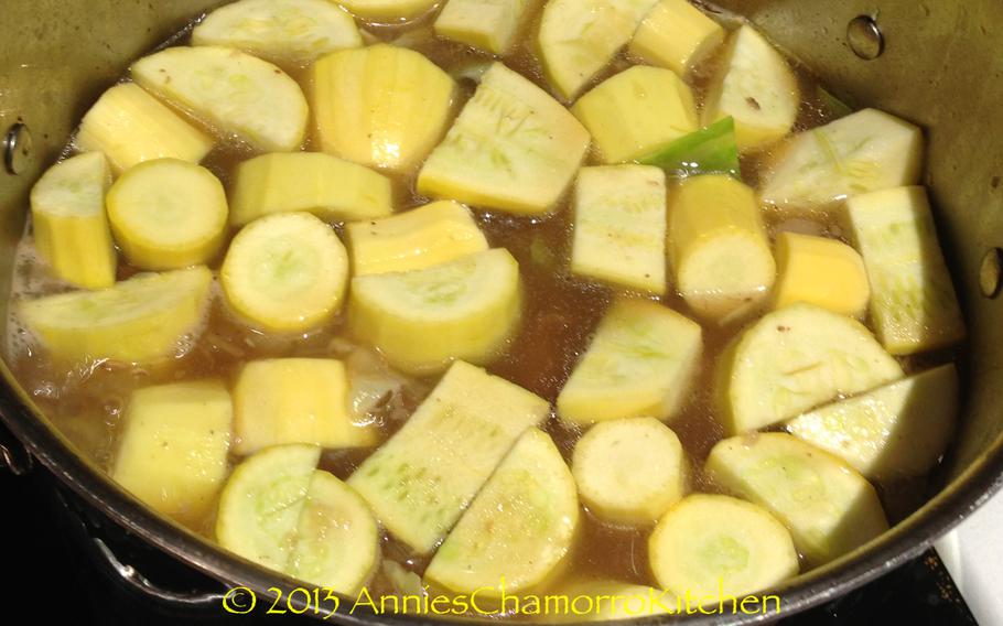 Layer the squash on top of the cabbage leaves, also pressing them into the broth (do not stir the vegetables into the soup–they will cook ON TOP of the ribs).