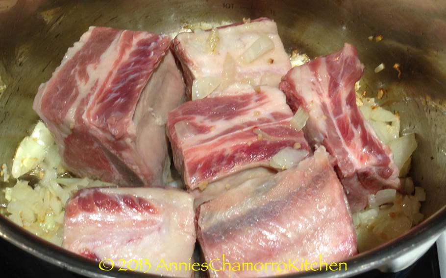 Add the short ribs and garlic.