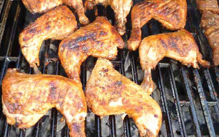 vinegar marinated chicken on a grill.