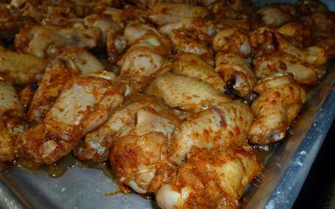 Photo Of Hot wings are on a tray.