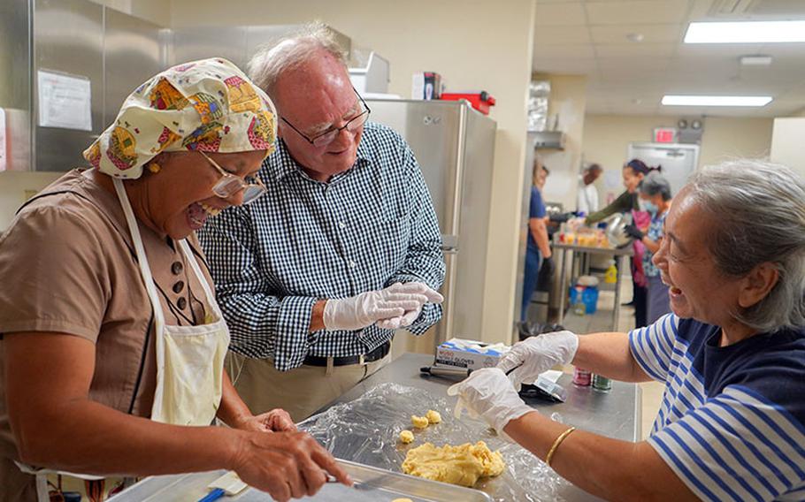 Participants of the Nihi ta Fanmama’tinas (Let’s Cook): Reducing Added Sugars Workshop on Nov. 16 at the University of Guam share a laugh while learning to make whole-wheat rosketti. Photo courtesy of the University of Guam