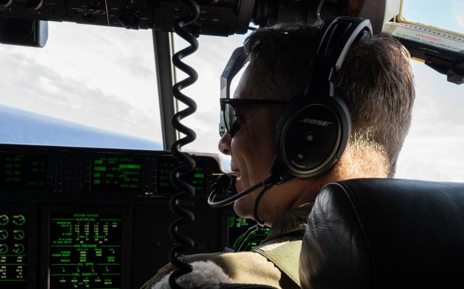 U.S. Air Force Maj. Gavin Warmbold is smiling in the cockpit.