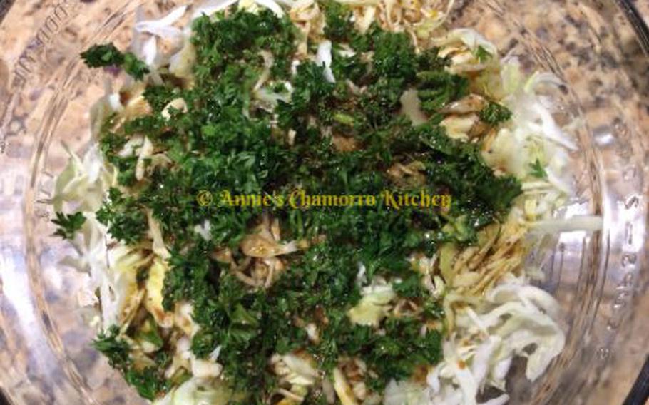 Pour the dressing over the cabbage and parsley.