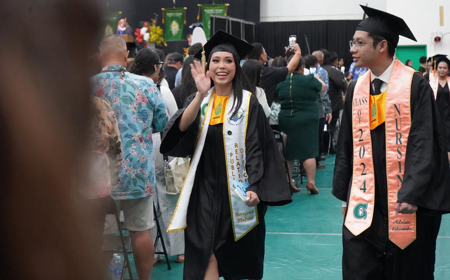 Norajean Mafnas, a graduate of the B.S. Social Work Program, walks into the Calvo Field House during the opening procession of the University of Guam commencement on May 19.