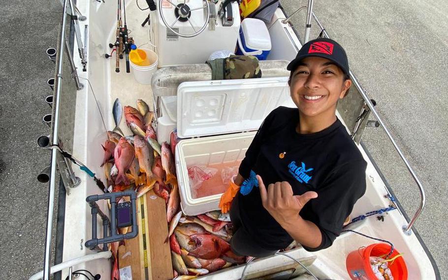 Project lead Leilani Sablan from the University of Guam Center for Island Sustainability and Sea Grant’s Guihan for Guahan program assists with fish measurements during a data collection session.   Guihan for Guahan is focused on the long-term monitoring of Guam’s reef fisheries and translating the science of sustainable fishing to the community. 