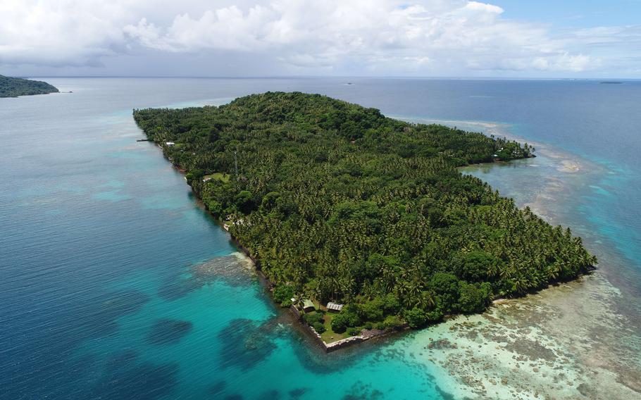 A view of Etten island, called Takeshima during Japanese times, from a drone. Much of the island is reclaimed land, built and used as an airstrip during World War II. The long straight coastline is a wall built up with basalt rocks. Coconut trees were planted after the war, as part of developing a copra industry.