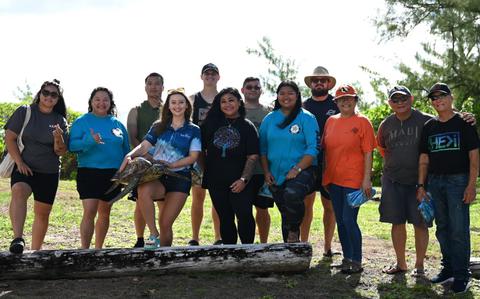 Photo Of The marine biology department from The University of Guam pose alongside Andersen Air Force Base 36th Civil Engineers Squadron and Andersen AFB Marine Patrol Volunteer Conservation Officer Program at Andersen Air Force Base, Guam.