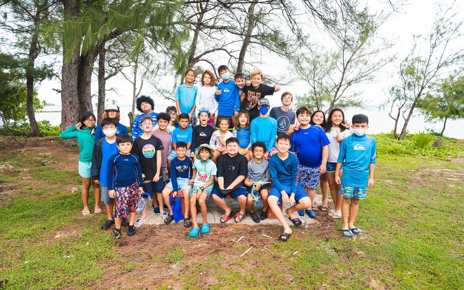 Summer campers take a group photo after a day of rod-and-reel fishing off the coast of Ypan for the 4-H Junior Fishing Summer Camp in June 2022.