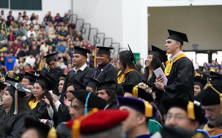 (From left) Agriculture majors Scott Davis Jr., Risel Uludong, and Aubrie Uson and biology majors Sherald Mae Alvarez and Antoni Badowski stand for the presentation of degree candidates from the College of Natural and Applied Sciences.