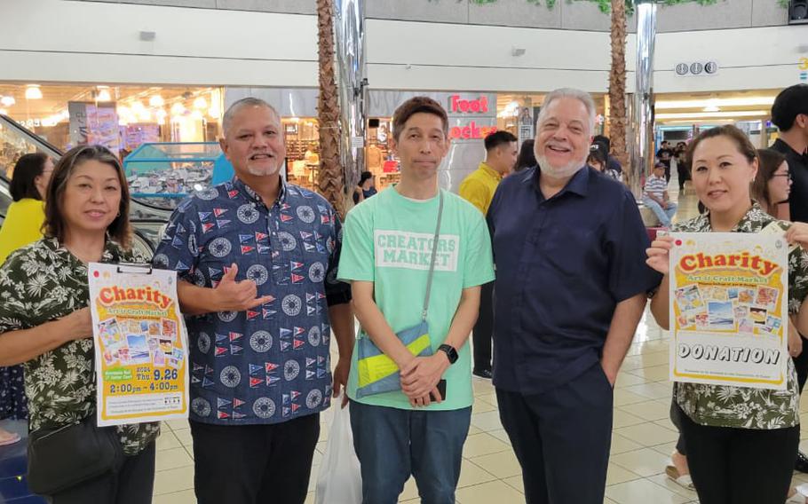 Students from the Niigata College of Art and Design pose with Carlos Taitano, Director of UOG’s Global Learning and Engagement (second row, fourth from right) and James D. Sellmann, Dean of UOG’s College of Liberal Arts and Social Sciences (second row, fifth from right) at the annual Charity Art and Craft Market benefitting UOG’s Fine Arts program.