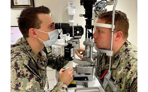 Photo Of U.S. Navy Lt. Joseph Jeskie, an optometrist at Naval Branch Health Clinic Kings Bay, Georgia, performs an eye exam on a patient. “As part of our overall health, everyone requires a comprehensive eye exam from an optometrist or ophthalmologist on a regular basis,” Jeskie said. “In the early stages, many eye diseases like glaucoma, macular degeneration, and diabetic retinopathy have virtually no symptoms.”