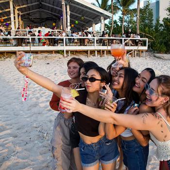 women taking a picture at The Beach Restaurant and Bar Guam