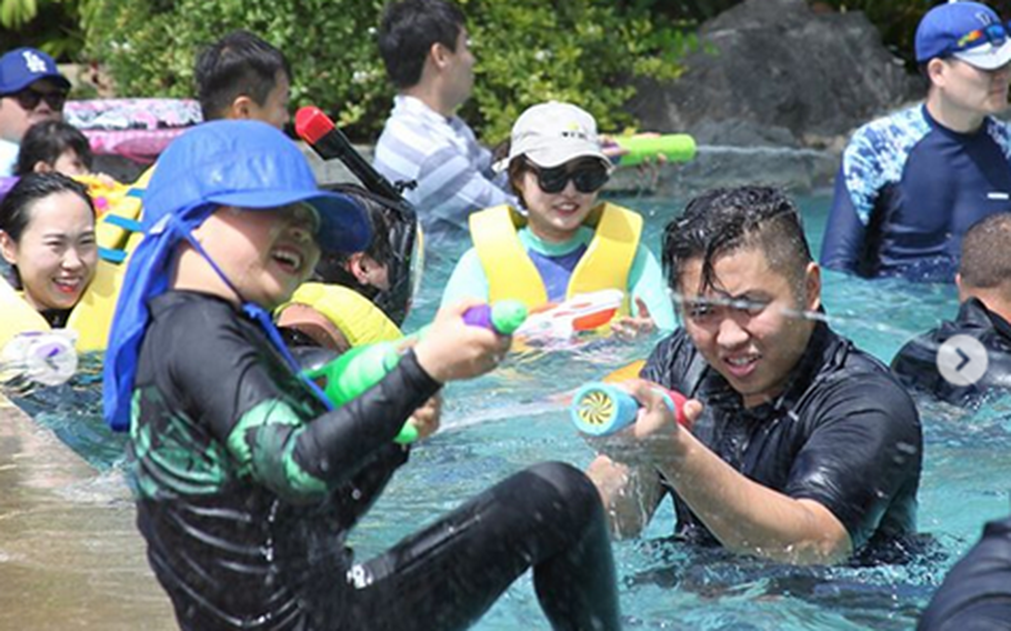 Hotel guests and staff engage in aquatic activities at the poolside during previous water festival in 2018.