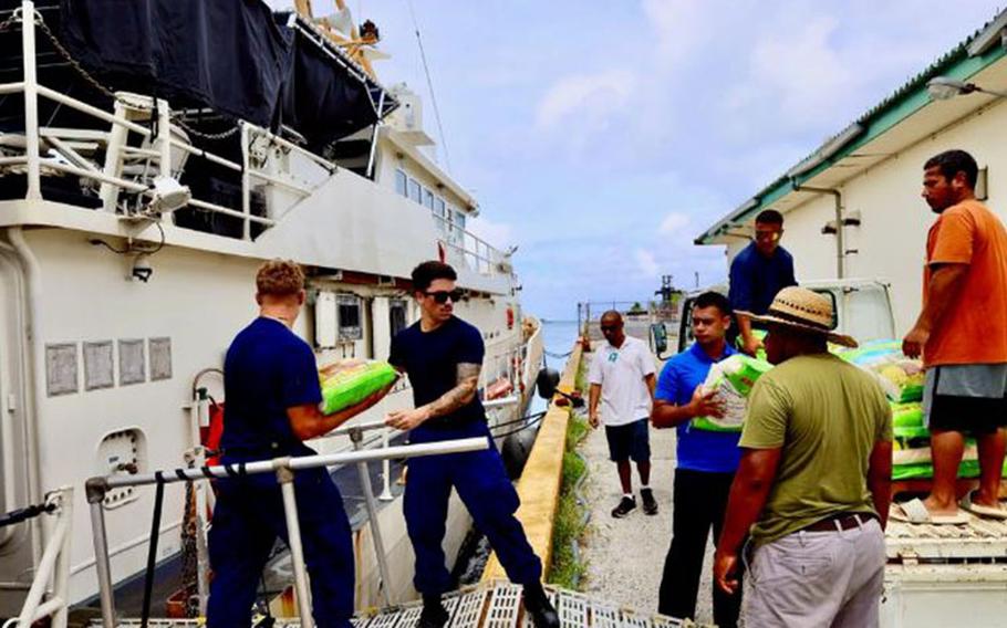 The crew of USCGC Oliver Henry (WPC 1140) onload resources in Pohnpei, Federated States of Micronesia, on Feb. 1, 2024, for delivery to the outer islands of the FSM to combat the effects of a current drought. The supplies included heavy-duty batteries, 2,000 lbs of rice, three medical kits, 70 gallons of bottled water, and boxes of paper products.