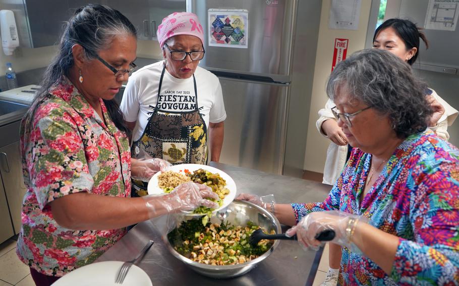 Workshop participants are putting ingredients into a bowl.