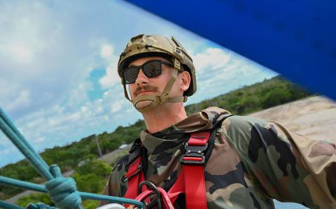 Photo Of Capt. Wyatt Huff, 736th Security Forces Squadron, practices rescuing a suspended victim at Andersen Air Force Base, Guam, May 8, 2025. The student is attached to the patient basket to increase their ability to navigate through obstacles while helping the victim up the wall. 