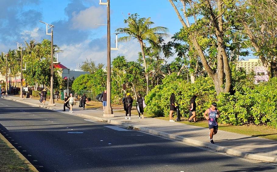 Dusit Guam staff come together to pick up trash along Pale San Vitores Road in Tumon.