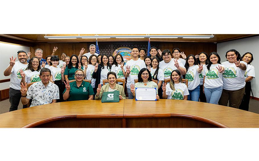 Gov. Lou Leon Guerrero, center, signs a proclamation designating March as the University of Guam’s Charter Day Month. UOG President Anita Borja Enriquez, right, and UOG Senior Vice President and Provost Sharleen Santos-Bamba, applaud the governor during the ceremony at the Office of the Governor’s main conference room at Adelup Friday, March 1.