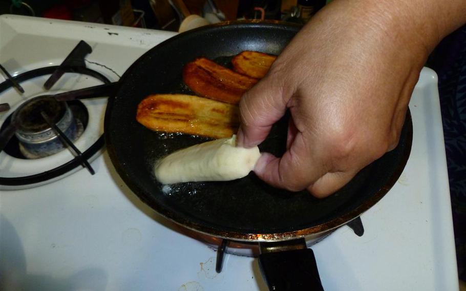 Place the battered banana slices one at a time in the hot oil. Oil should be about 375 degrees F.