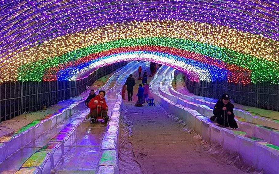 people enjoying ice slide.