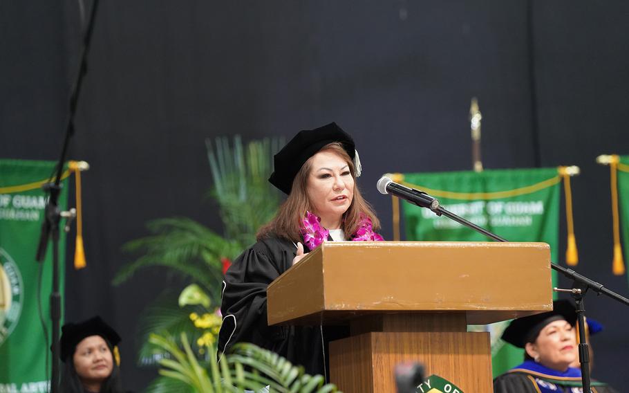 Lisa Carbullido Henderson delivers the commencement address at the University of Guam Fanuchånan 2024 Commencement Ceremony on Dec. 15 in the Calvo Field House.