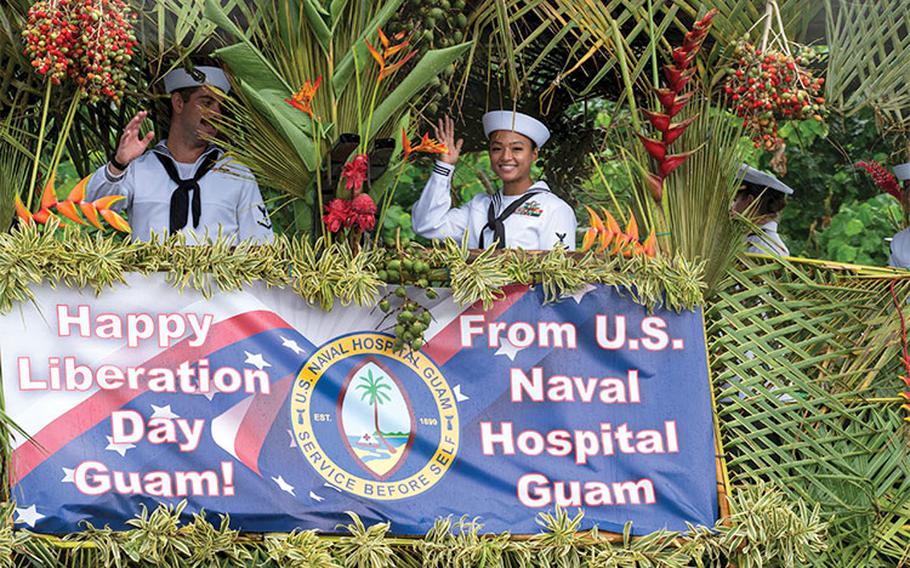 Two military personnel are smiling during the ceremony.