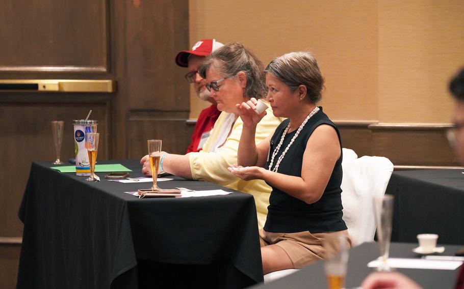 Sharon Bidaure, a farmer and manager of the Farmers’ Cooperative Association of Guam, participates in a special tea-tasting presentation on mindfulness and stress relief at the Guam AgrAbility Regional Workshop