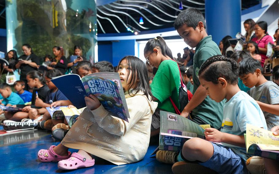 An elementary school student looks on as she peruses the latest issue of Guam’s only STEM magazine for kids – CHalan Deskubre.