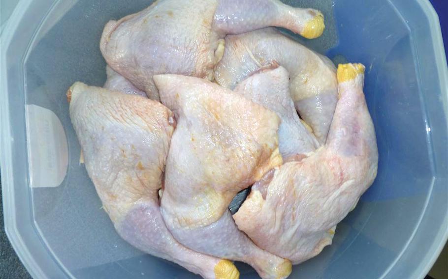 raw chicken in a plastic bowl.