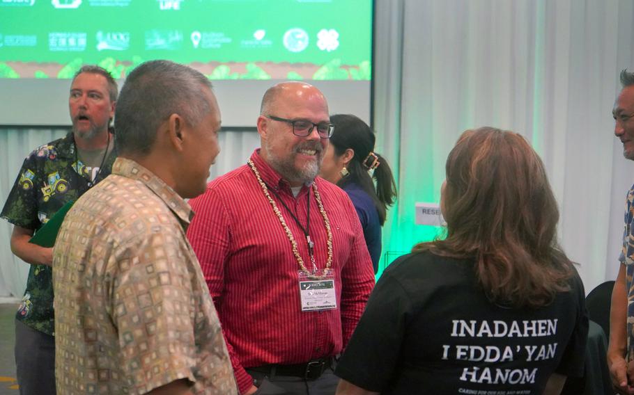 Don McMoran, project director for the Western Regional Agricultural Stress Assistance Program and director of Skagit County Extension with Washington State University, visits with Guam growers during the Guam AgrAbility Regional Workshop.