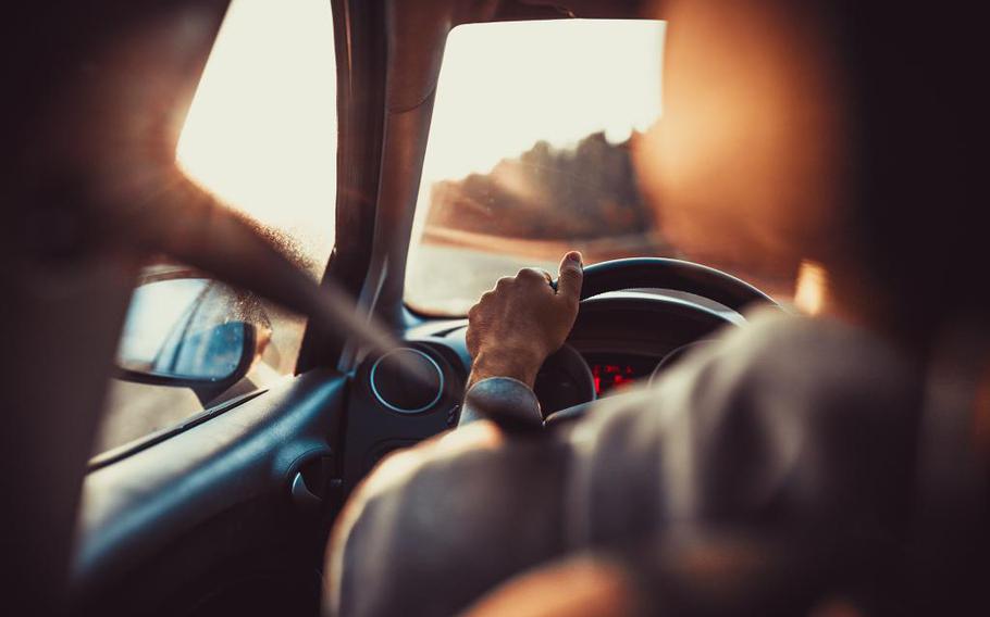 a person driving a car.