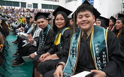 Photo Of Health Science graduates pose for a photo at the University of Guam Fañomnåkan (Spring) 2024 Commencement Ceremony last May at the UOG Calvo Field House.  