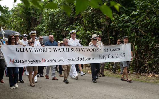 U.S. service members, Guam residents, and supporters participate in a march to the Mañenggon Memorial Ceremony.