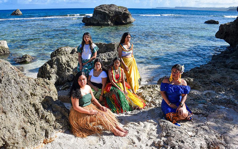 Six students are on the beach.