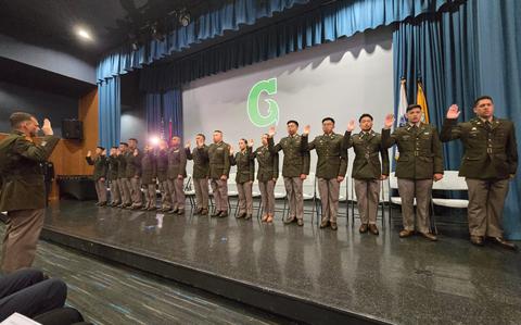 Photo Of The sixteen members on the stage.