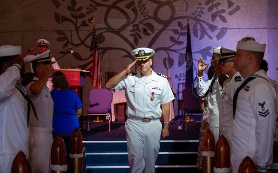 Photo Of Capt. Carl Trask is piped ashore following the change of command ceremony for Submarine Squadron 15 held Friday, June 14, onboard Naval Base Guam. During the ceremony Trask turned over command of the squadron to Capt. Neil Steinhagen. Commander, Submarine Squadron 15, based at Polaris Point, Naval Base Guam, is home to four Los Angeles-class fast-attack submarines forward-deployed in the Pacific. Renowned for their unparalleled speed, endurance, stealth, and mobility, these submarines are the backbone of the Navy’s submarine force.