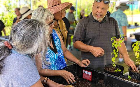 Photo Of Mark Acosta, an extension agent of sustainable agriculture with University of Guam Cooperative Extension & Outreach, gives residents some tips on growing plants in containers during a workshop last July. Starting May 27, UOG Extension will hold a first-time Garden-to-Table Workshop, focusing on how to grow productive, low-maintenance food plants in a residential setting and how to cook with them.   