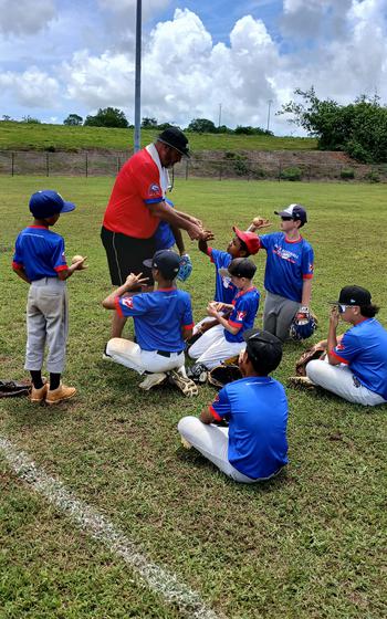 A coach teaching how to throw.