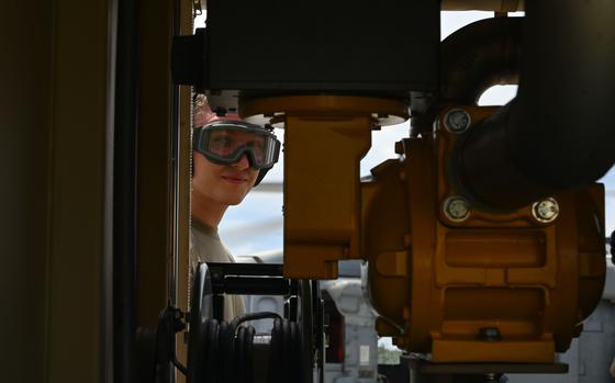 Photo Of Airman Brayden Costley, 36th Logistics Readiness Squadron fuels distribution operator, peers through a STARCART at the Pacific Regional Training Center – Andersen Air Force Base, Guam on Sept. 24, 2024. Costley learned how to operate a STARCART used for hot-pit refueling from specialists with the 36th Contingency Response Squadron.