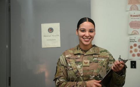 Photo Of U.S. Air Force Tech. Sgt. Melissa Leonardo, a 379th Expeditionary Medical Group mental health technician, poses for a photo at the Mental Health Office waiting room at Al Udeid Air Base, Qatar. The Mental Health Office is a specialty clinic designed to treat significant depression, anxiety and trauma.