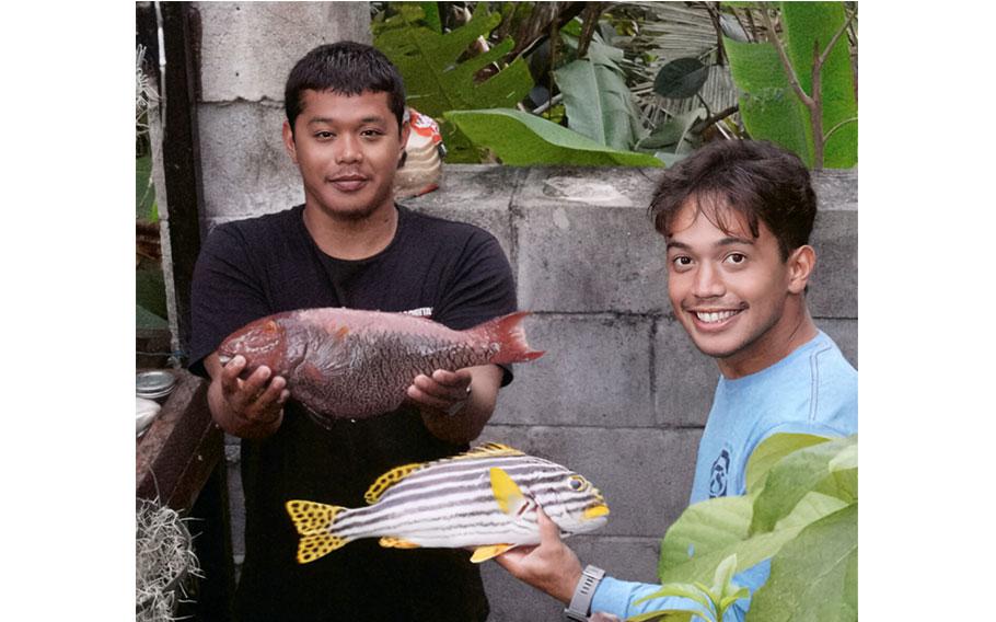 Local fishers Jaden Guerrero and Rob Quintanilla show off their catch.