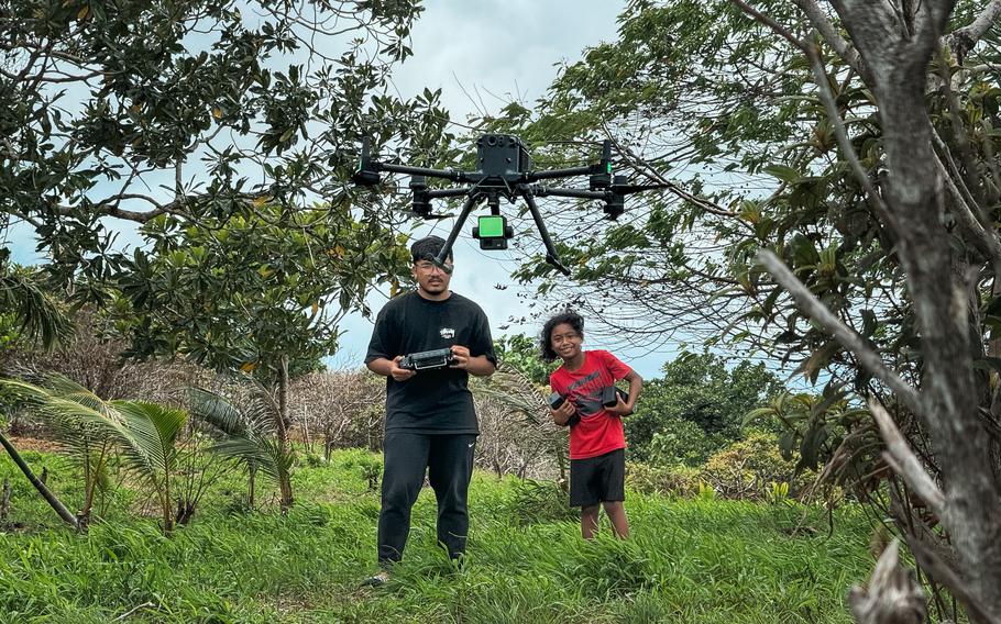 Thomas Torres II operates a DJI M350 RTK equipped with a LiDAR sensor during a mapping mission in Aimeliik, Palau.