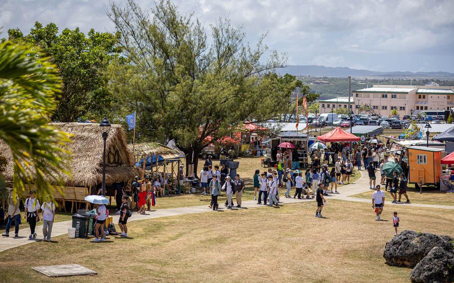 Students on field trips and other attendees check out displays at the 56th Charter Day at the University of Guam on Thursday, March 7.