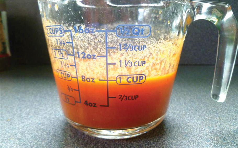 Seasonings are in a plastic cup.