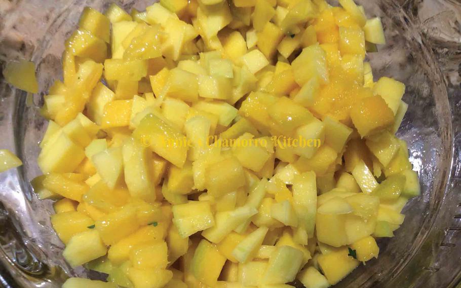Cut the skin off the mango. Dice the mango into 1/4-inch cubes. Place into a small mixing bowl.