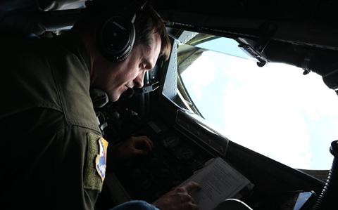 Photo Of Master Sgt. Jonathan Legan performs preflight aircraft controls.