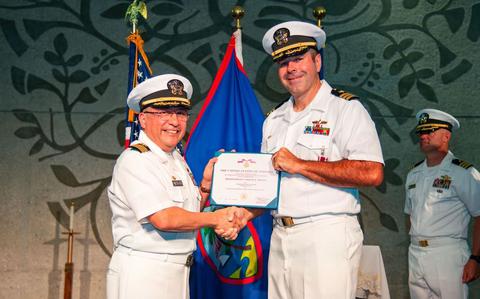 Photo Of Capt. David Reyes, commodore, Military Sealift Command Far East, awards Cmdr. Kris Blandin with the Meritorious Service Medal during a change of command ceremony for MSC Ship Support Unit Guam at the Naval Base Guam chapel, May 16. Blandin relinquished command of MSC SSU to Cmdr. Paul Tortora during the ceremony. MSC directs and supports operations that replenish U.S. Navy ships at sea, conduct specialized missions, preposition combat cargo at sea around the world, perform a variety of support services, and move military equipment and supplies to deployed U.S. forces. 