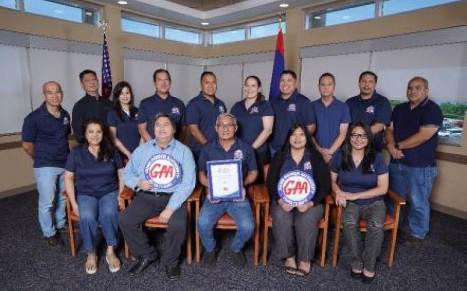 Photo caption: Pictured front row from left are Joyce N. Sayama, Communications Manager; John J. Cruz Jr., P.E., Assistant General Manager of Engineering and Technical Services; John M. Benavente, P.E., General Manager; Jennifer G. Sablan, P.E., Assistant General Manager of Operations; Maripaz N. Perez, Assistant Chief Financial Officer. Back row from left are Francis J. Iriarte, SPORD Engineer Supervisor; Melvyn K. Kwek, Chief Information Technology Officer; Lorraine O. Shinohara, Acting SPORD Manager; Albert N. Florencio, SPORD Engineer III; Christian Chargualaf, SPORD Engineer I; Juliana Maria F. Baza, SPORD Engineer III; Roman A. Sablan-Cruz, SPORD Administrative Officer; James Borja, Utility Services Administrator; Harvey J. Camacho, SPORD Management Analyst III; Vincent J. Sablan, P.E., Manager of Engineering.